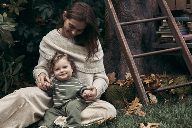 Mom sitting with baby