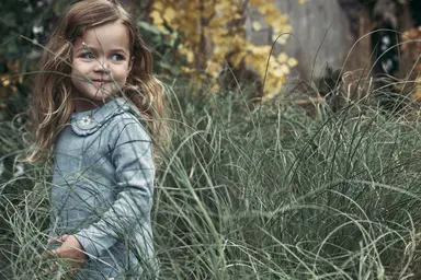 Girl standing in grass