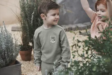 Kids standing outside smiling