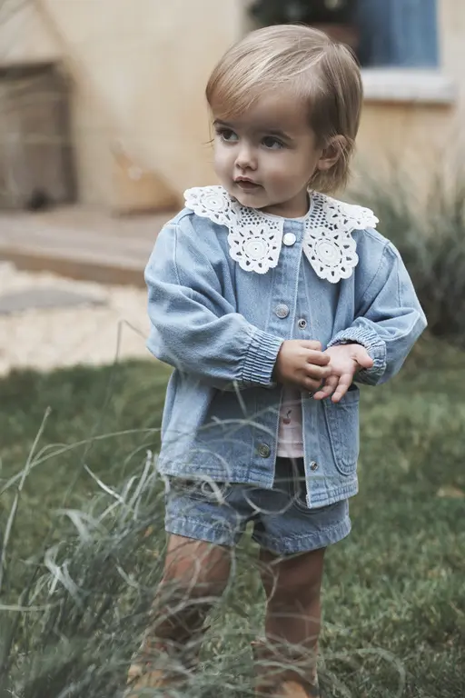 Girl standing in grass