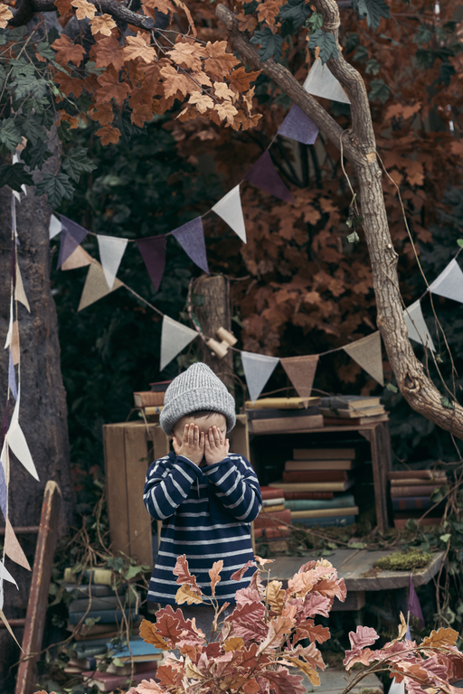 Boy playing hide and seek