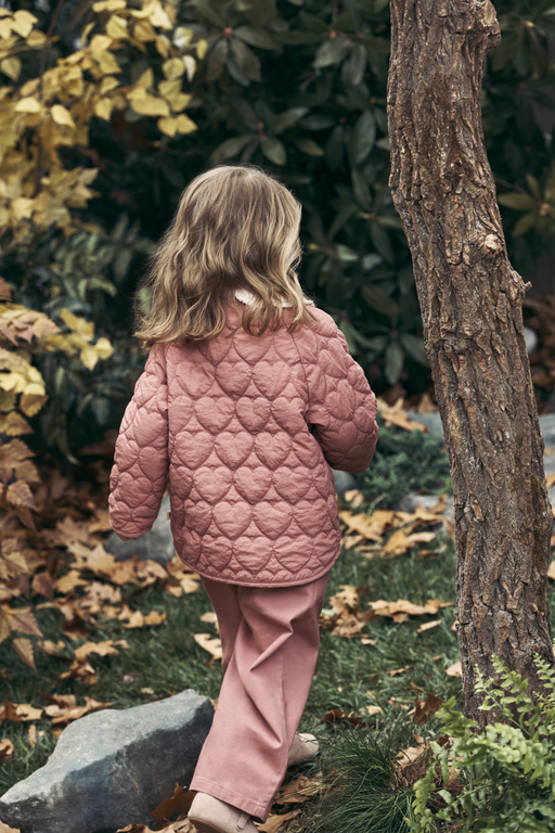 Girl walking through woods