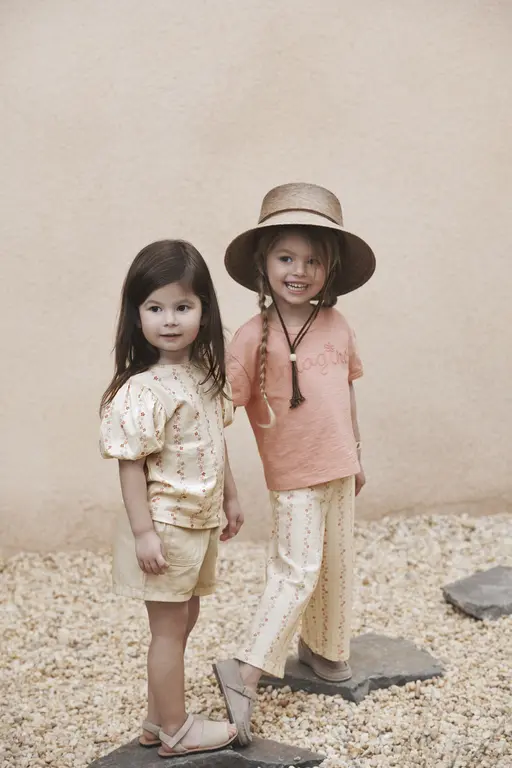 Toddlers standing in rocks