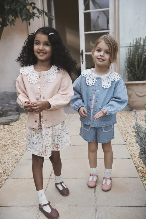 Girls standing outside in jackets