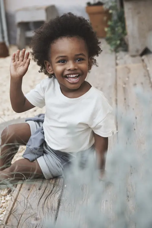 Kid waving and smiling