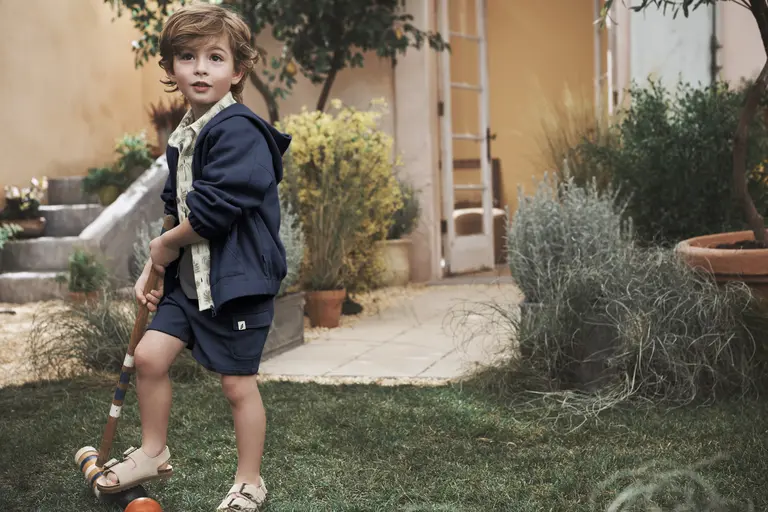 Kid wearing jacket outside