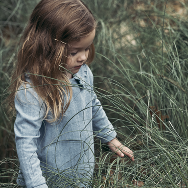 Girl standing in grass