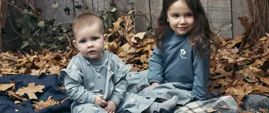 Girls sitting on blanket