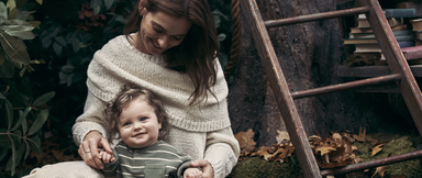 Mom sitting with baby