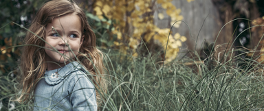 Girl standing in grass