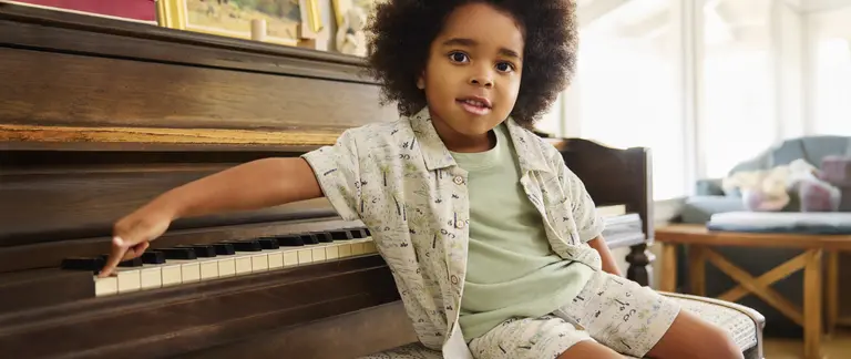 Kid sitting at the piano