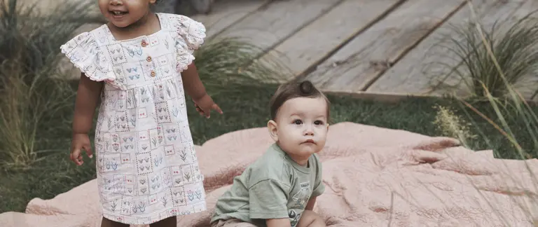 Babies on blanket outside